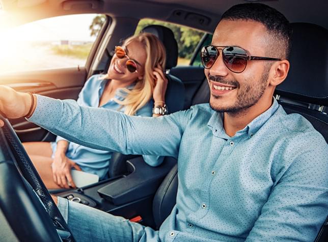 Two people in a car - link to The General Auto Shop Insurance Page